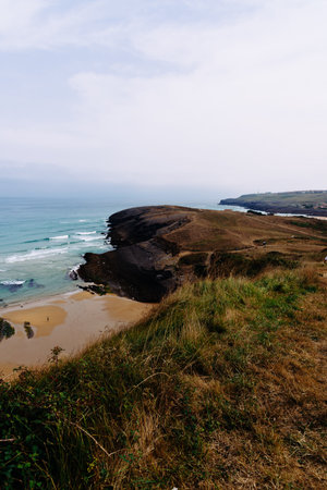 Antuerta Beach. Beach surrounded by cliffs and very popular for surfersの写真素材