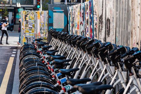 Row of parked electric rental bicycles in MAdridのeditorial素材
