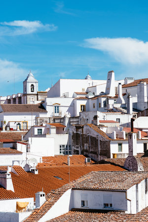 Cityscape of Evora with typical houses painted in white and ceramic tiled roofsのeditorial素材