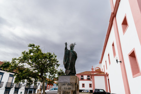 Statue of John Paul II at the Cathedral of Angra do Heroismo at sunsetのeditorial素材