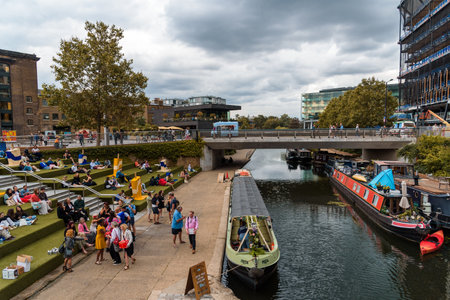 London, UK - August 25, 2023: Regents Canal at Kings Cross. People enjoying the walk by the canalのeditorial素材