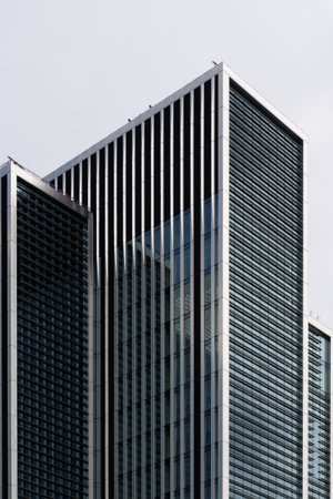 London, UK - August 25, 2023: Low angle view of modern office buildings in the City of London and...