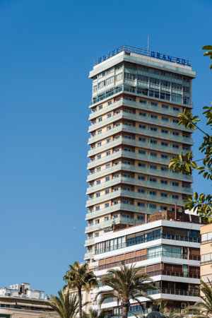 Alicante, Spain - October 13, 2023: Gran Sol Melia Hotel skyscraper on the coast near the harbour.のeditorial素材