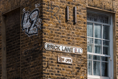 London, UK - August 25, 2023: Brick Lane Street Name Sign on brick wallのeditorial素材