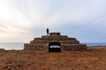 Ciutadella, Spain - May 13, 2024: The Lighthouse of Punta Nati at sunsetのeditorial素材