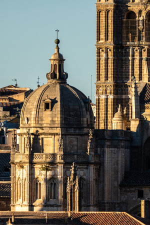 View of the Cathedral of Saint Mary of Toledo in Spain, featuring its Gothic architecture and sandstone facade during the day.の写真素材