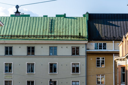 Facades of buildings with colorful roofs are captured on a bright day in Helsinki, Finland.の写真素材