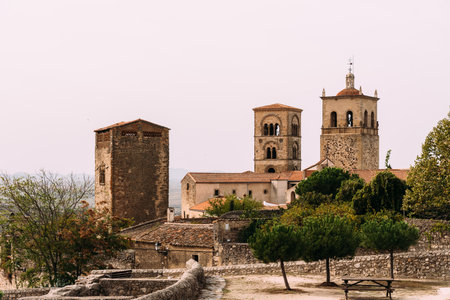 An elevated view of Trujillo, Extremadura, showing historic stone buildings, towers, and the...