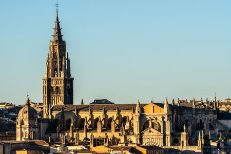 View of the Cathedral of Saint Mary of Toledo in Spain, featuring its Gothic architecture and sandstone facade during the day.の写真素材