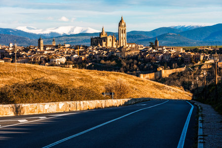 Distant view of Segovia, Spain, with the Guadarrama mountain range in the background, offering a striking landscape.の写真素材