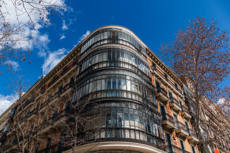 A detailed low angle view showcases the architecture on a sunny day in the capital of Spain, Madrid.の写真素材