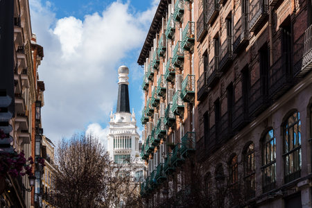 A view of Madrid's charming architecture, capturing the essence of the city's historic streets and iconic buildings on a bright, sunny day. The Letters quarterの写真素材