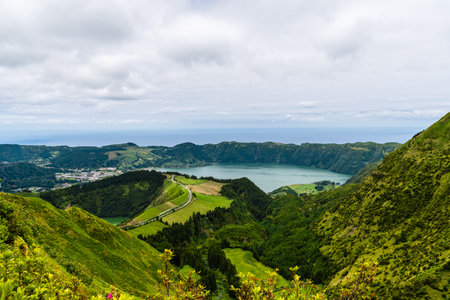 A stunning panoramic view of Sete Cidades lake and surrounding lush green hills on Sao Miguel...