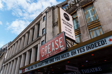 London, UK - August 27, 2023: The Dominion Theatre in Covent Garden, London, displays signage for...