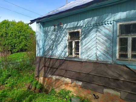 Country old rural house in the middle of the forest. surrounded by fruit bushes.unique image for decorationの写真素材