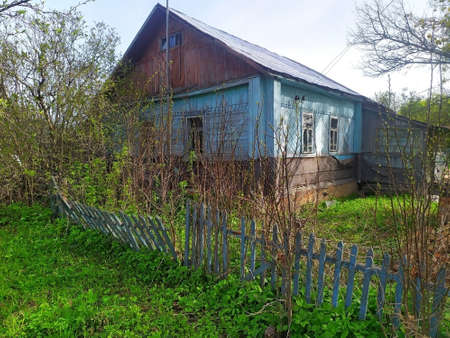 Country old rural house in the middle of the forest. surrounded by fruit bushes.unique image for decorationの写真素材