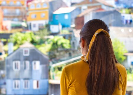 Young woman clapping her hands on the balcony showing gratitude to all the healthcare workers during...