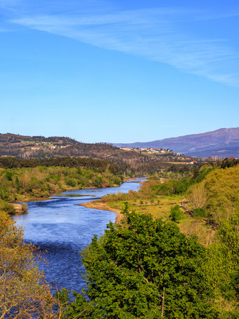 Landscape view of the river and forest in the countryside, Spain. River MiÃ±o is the natural frontier between Spain and Portugal.の写真素材