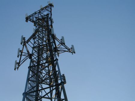 Cell tower against blue sky