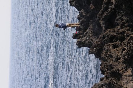 Rock Climber at the Atlantic Ocean in Tenerife Canary Islands Spainの写真素材