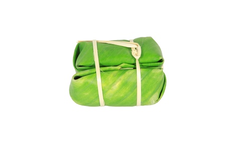 Thai style dessert, made from banana and glutinous rice, wrap with banana leaf の写真素材