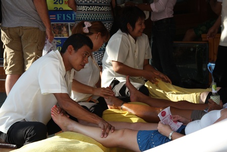 Traditional Thai foot massage in Khao San Road, Bangkok, Thailand - 25.07.2011 Traditional Thai foot massage in Khao San Road, Bangkok, Thailand - 25.07.2011
