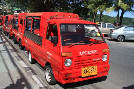 New style red tuk-tuk taxi in Patong, Phuket Island, Thailand - 08.08.2011