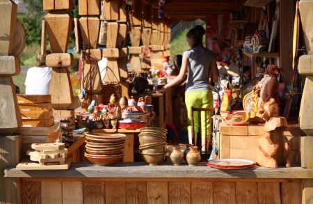 Variety of traditional Russian souvenirs for sale in street, Gorodets, Russia - 09.08.2012のeditorial素材