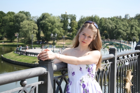 Pretty blond girl at the city park on a summer dayの写真素材