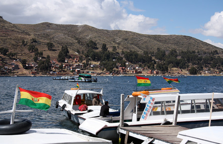 BOLIVIA, LAKE TITICACA, TIQUINA STRAIT, 10 SEPTEMBER 2013 - Tourist boats in the Strait of Tiquina at Titicaca lake, Boliviaのeditorial素材