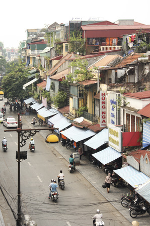 VIETNAM, HANOI, 8 AUGUST 2014 - Morning view of the foggy street with motorbikes in the old part of Hanoiのeditorial素材