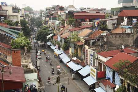 VIETNAM, HANOI, 8 AUGUST 2014 - Morning view of the foggy street with motorbikes in the old part of Hanoiのeditorial素材