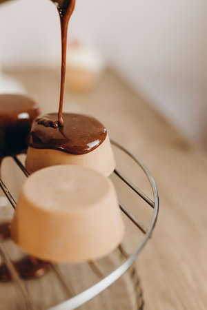 Baker decorating dessert, by filling chocolate on it.の写真素材