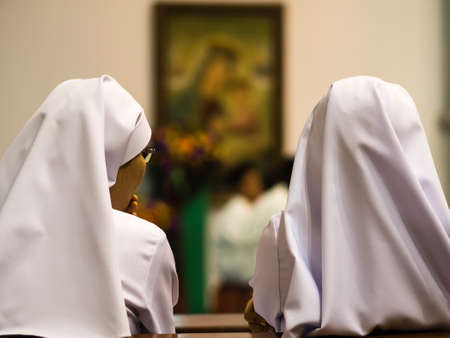 two nuns in churchの写真素材
