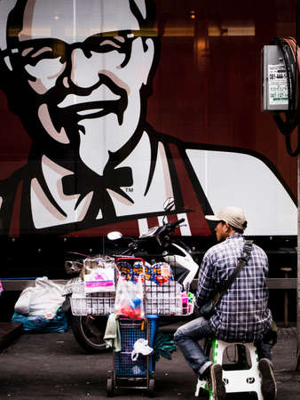 man selling stuff on street sideのeditorial素材