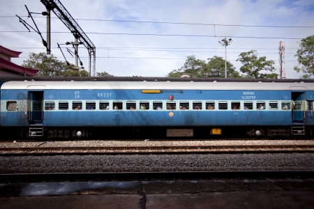 Varkala, India-September 09, 2012. Passengers leaning out the window of the train waiting for it to start upのeditorial素材