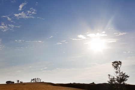 On the highest hill of Olkhon, several tourists strollingの写真素材