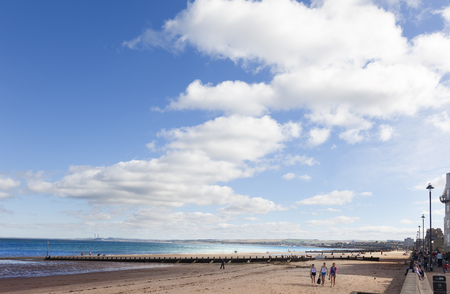 Edinburgh, Scotland-September 22, 2013: On sunny days, the people of Edinburgh take the opportunity to stroll along Portobello Beachのeditorial素材