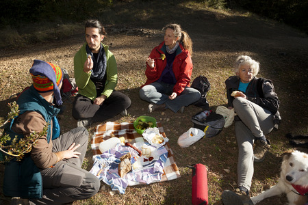 Los Ports mountains, Spain-November 12, 2017: Group of friends making a picnic on the mountain after hikingのeditorial素材