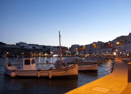Es Castell, Menorca-August 27, 2015. Sunset in Es Castell harbor, one of the most touristic harbor in Menorcaのeditorial素材