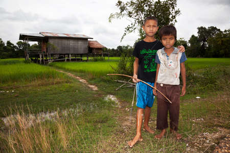 Don Khong, Laos. July 31, 2009:Children leave their house to hunt with bow and arrowのeditorial素材