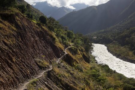 People spend 15 days walking by Inca's way to MachuPicchu. A young men walk through the jungle direction to Aguas Calientesの写真素材