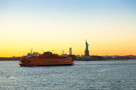 New York, USA-June 8, 2017: Many tourists take the ferry from New York to New Jersey to take pictures The statue of Liberty and the skyline of downtown of Manhattanのeditorial素材