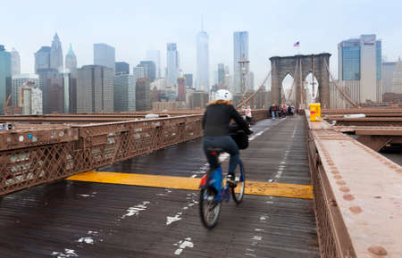 Manhattan, USA-June 6, 2017: Crossing the Brooklyn bridge towards manhattan covered by fogのeditorial素材