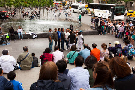 New York, USA-June 8, 2017: People enjoy watching and participating in street performances....