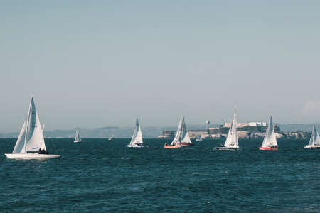 San Franciso, CA, USA-June 22, 2017: Sunset in San Francisco Bay during a sailboat race. Californiaのeditorial素材