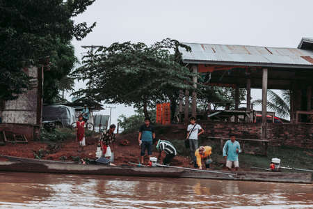Si Phan Don, Laos-August 1, 2009: One of the most typical means of transport in Laos is by canoeing down the Mekong Riverのeditorial素材