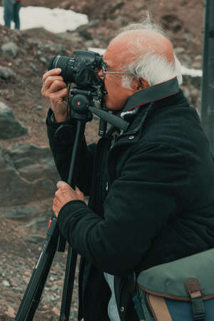 Cajon of Maipu, Chile-June 22, 2014: Photographer taking pictures on the Andes mountains