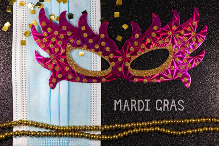 Mardi Gras Party Mask With Medical Facemask And Bead Stringの写真素材