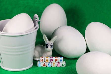 Happy Easter Bunny With Large White Eggs And Bucket